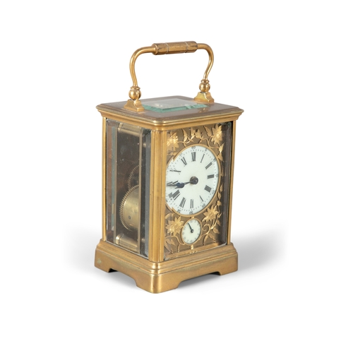 131 - A FRENCH GILT BRASS CARRIAGE CLOCK CIRCA 1900,   with raised swing handle, bevelled glass plates and... 