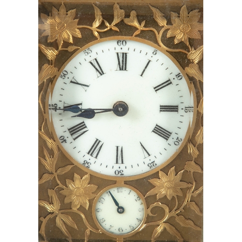 131 - A FRENCH GILT BRASS CARRIAGE CLOCK CIRCA 1900,   with raised swing handle, bevelled glass plates and... 