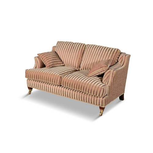 137 - A STRIPED TWO SEATER SOFA   upholstered in a cream and red fabric, with loose seat cushions, on timb... 