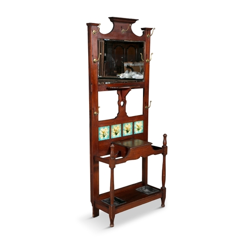 149 - AN ART NOUVEAU MAHOGANY FRAME HALLSTAND, C.1900,   with mirrored panel back, inset with a row of fou... 