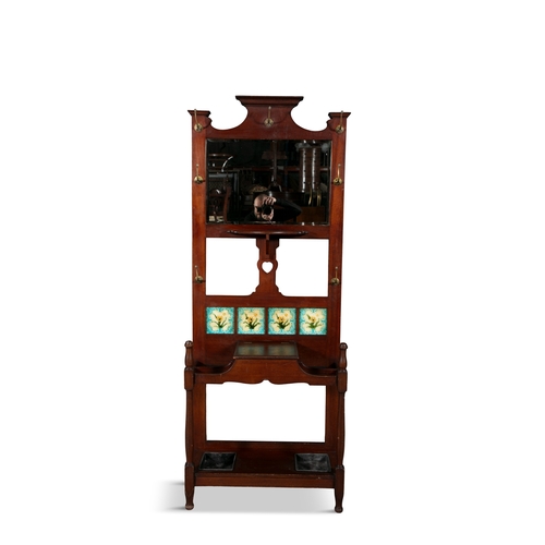 149 - AN ART NOUVEAU MAHOGANY FRAME HALLSTAND, C.1900,   with mirrored panel back, inset with a row of fou... 