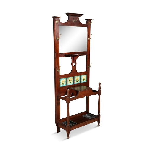 149 - AN ART NOUVEAU MAHOGANY FRAME HALLSTAND, C.1900,   with mirrored panel back, inset with a row of fou... 