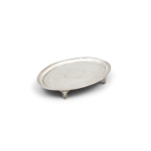 180 - A GEORGE III SILVER OVAL CARD TRAY    London, c.1797, of neoclassical design, with vacant central re... 