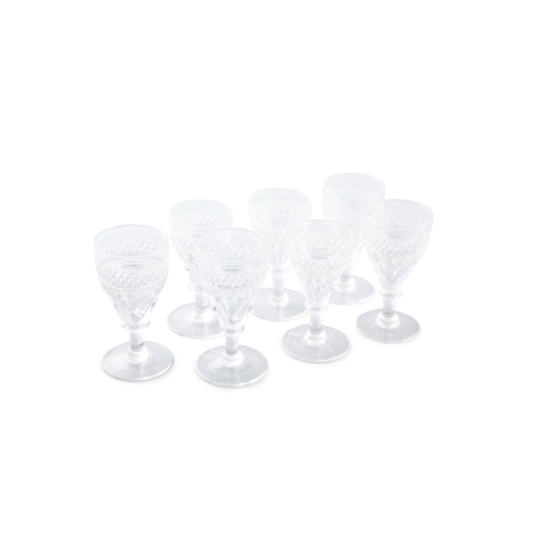 188 - A SET OF 7 SHERRY GLASSES,   each with bands of diamond cut decoration, raised on circular foot. Eac... 