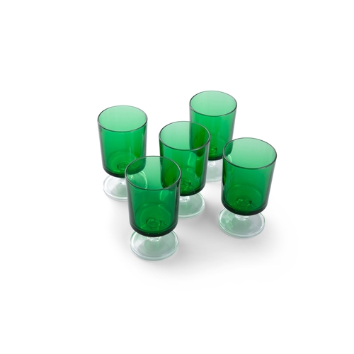 191 - A SET OF FIVE GREEN GLASSES SHORT CYLINDRICAL GLASSES,  raised on clear foot. 10.5cm high