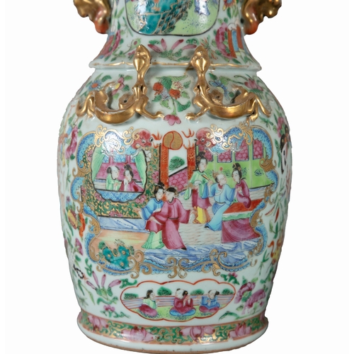 215 - A PAIR OF CHINESE CANTON VASES  the flared rims, baluster bodies decorated in the traditional taste ... 