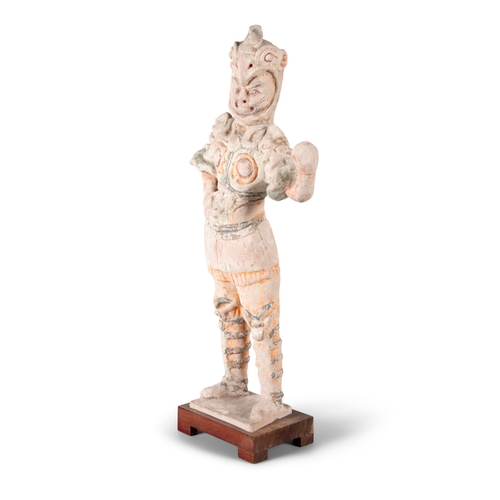 219 - A CHINESE PAINTED TERRACOTTA FIGURE OF A STANDING WARRIOR,   in Han Style, dressed in full armour, w... 