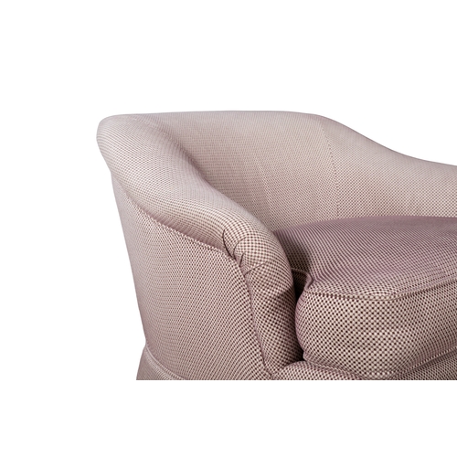 224 - A PAIR OF HOWARD STYLE ARMCHAIRS,   upholstered in pink and white woven fabric, raised on short maho... 