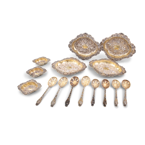 257 - A SET OF VICTORIAN SILVER GILT 'BACCHANALIAN PATTERN FRUIT SERVING DISHES AND SPOONS   London, c.189... 