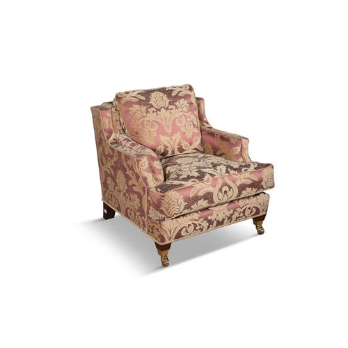 287 - A RED FLORAL DAMASK UPHOLSTERED ARMCHAIR   covered in a red and cream fabric, with loose seat cushio... 