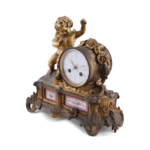 291 - A GILT METAL AND PORCELAIN MANTLE CLOCK, 19TH CENTURY  surmounted by putto and circular glazed dial ... 