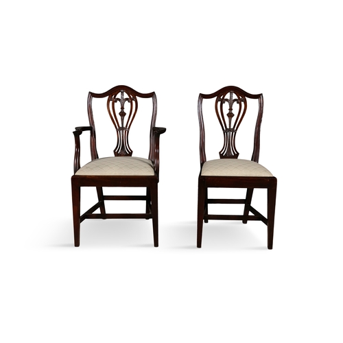 319 - A SET OF TWELVE MAHOGANY FRAMED HEPPLWHITE STYLE DINING CHAIRS   comprising two carvers and ten sing... 