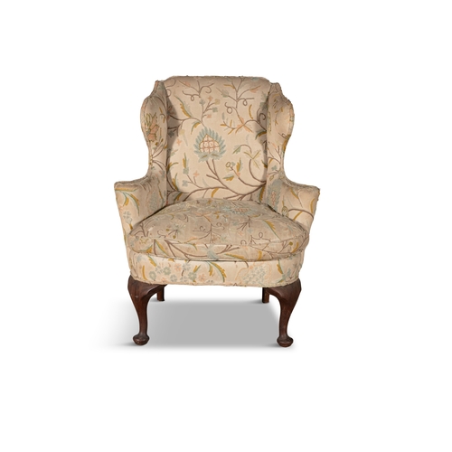 337 - A PADOUK FRAMED UPHOLSTERED WINGBACK ARMCHAIR 19TH CENTURY,  covered in a stumpwork fabric, with loo... 