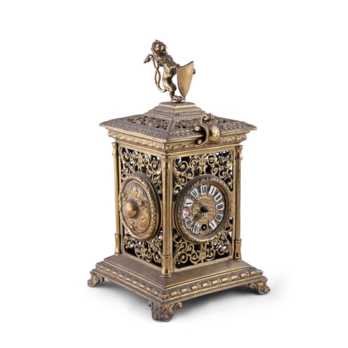 355 - A FRENCH CAST BRASS 'LANTERN' MANTLE CLOCK,  c. 1920, surmounted with a lion holding an armorial shi... 