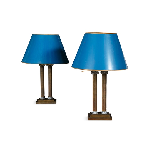 365 - A PAIR OF BRASS TWIN PILLAR IONIC COLUMN TABLE LAMPS  each fitted with double light sockets fitted c... 