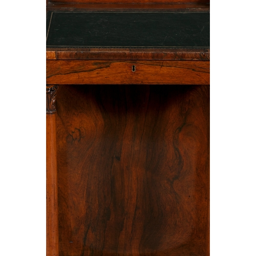 368 - A GEORGE IV ROSEWOOD DAVENPORT  the leather inset slope concealing interior fitted with drawers, abo... 