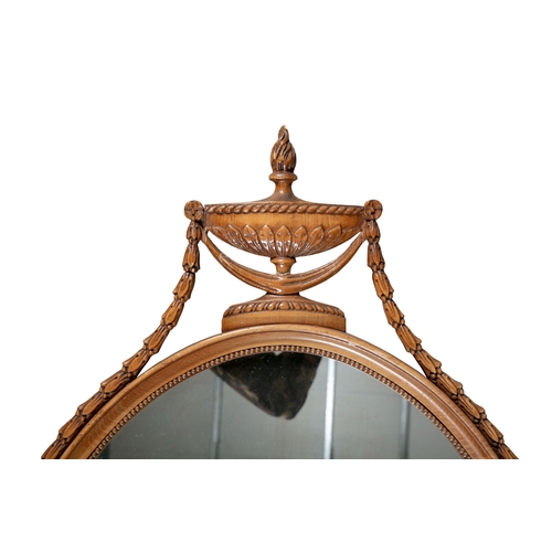 369 - A TIMBER FRAMED OVAL MIRROR 20TH CENTURY   fitted with plain glass plate and surmounted by a classic... 