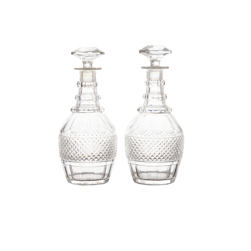 378 - A PAIR OF CUT GLASS DECANTERS AND STOPPERS,  triple ring necked, with diamond cut bodies, mushroom s... 