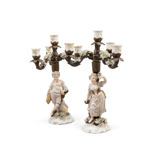 387 - A PAIR OF 19TH CENTURY GERMAN PORCELAIN FIGURAL CANDELABRA,   with four light, three branch detachab... 