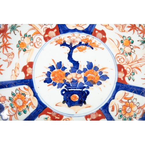 389 - THREE JAPANESE IMARI PLATES OF GRADUATED SIZES,  The largest 25cm diameter