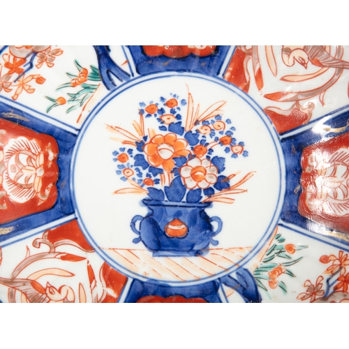 389 - THREE JAPANESE IMARI PLATES OF GRADUATED SIZES,  The largest 25cm diameter