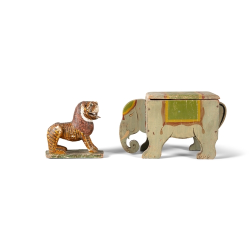 390 - A PAINTED TIMBER BOX IN THE FORM OF AN ELEPHANT,   with rectangular hinged lid, 26cm wide, 15.5cm hi... 