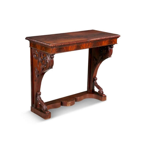 414 - AN EARLY VICTORIAN CARVED MAHOGANY CONSOLE TABLE CIRCA 1840  with solid panel top, gadrooned rim, ab... 