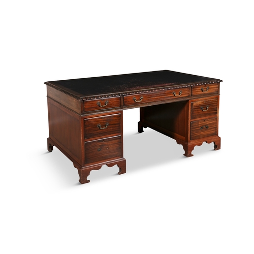 44 - A GEORGE III STYLE MAHOGANY WRITING DESK  of rectangular form, composed of three frieze drawers and ... 