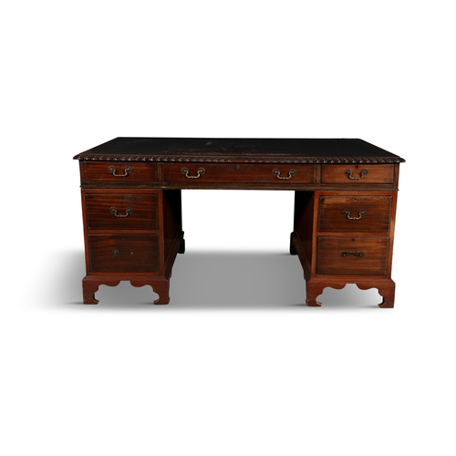 44 - A GEORGE III STYLE MAHOGANY WRITING DESK  of rectangular form, composed of three frieze drawers and ... 