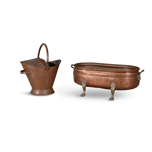 469 - A VICTORIAN COPPER AND BRASS MOUNTED OVAL CISTERN,   with raised side handles and leaf-cast paw feet... 