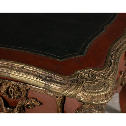 476 - A FRENCH KINGWOOD AND ORMOLU MOUNTED BUREAU PLAT  of shaped rectangular form, the top with tooled le... 