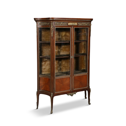 483 - A FRENCH MAHOGANY AND GILT METAL MOUNTED TWO-DOOR DISPLAY CABINET, C.1900,   with glazed panel doors... 