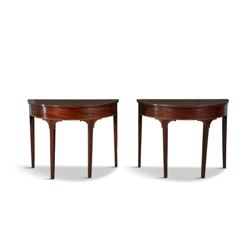 484 - A PAIR OF MAHOGANY SEMI ELIPTICAL SIDE TABLES 19TH CENTURY  each fitted with moulded tops above a br... 