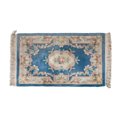 491 - A CHINESE BLUE AND CREAM GROUND WOOL RUG, 152CM LONG x 91CM WIDE   20th century, with heavy pile, wo... 