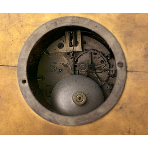 67 - A BRASS CASED MANTLE CLOCK AND A PAIR OF TAZZAS  42cm high, and 44cm high, respectively