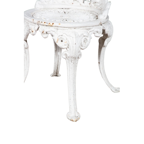 11 - A VICTORIAN CAST IRON GARDEN SET,  comprising a set of four white painted seats with pierced back an... 