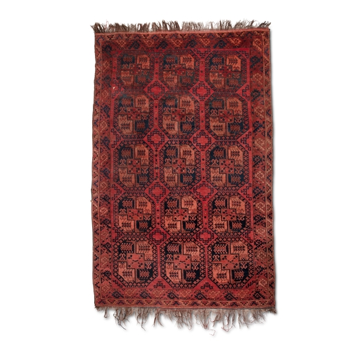 374 - A LARGE AFGHAN WOOL CARPET. 350 X 231CM    the shaded red field woven with three horizontal columns ... 