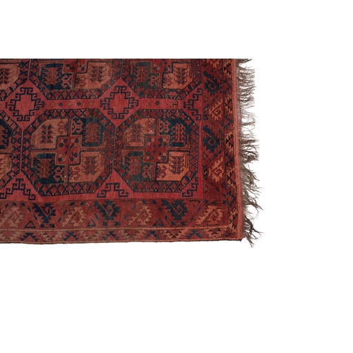 374 - A LARGE AFGHAN WOOL CARPET. 350 X 231CM    the shaded red field woven with three horizontal columns ... 