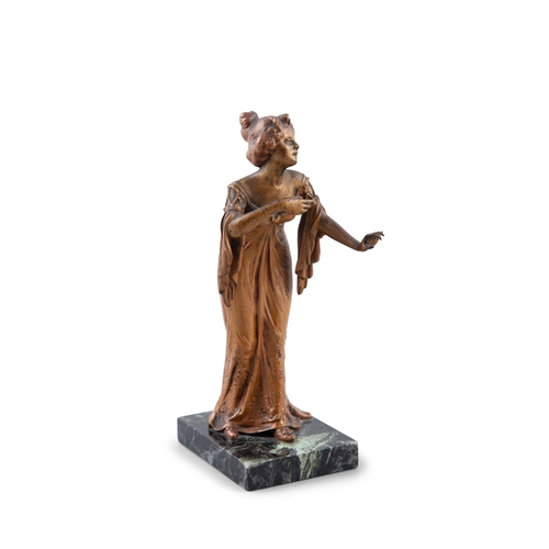 49 - A CONTINENTAL COLD PAINTED BRONZE FIGURE CIRCA 1900,   modelled as a lady standing with outstretched... 