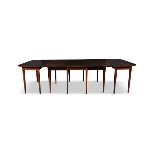 498 - A MAHOGANY EXTENDING DINING TABLE 19TH CENTURY,  of rectangular form, with rounded corners with gate... 