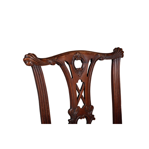 507 - A SET OF SIX IRISH CARVED MAHOGANY DINING CHAIRS  following the general design of the Malahide Castl... 