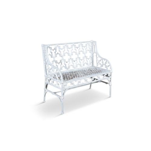 6 - A VICTORIAN WHITE-PAINTED CAST-IRON GARDEN SEAT,  in the Gothic style with open tracery back and hon... 