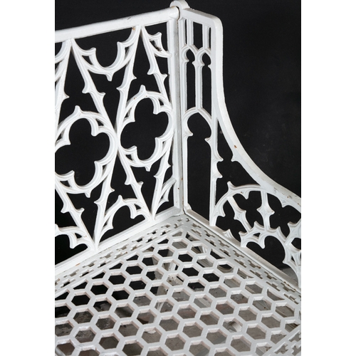 8 - A VICTORIAN WHITE PAINTED CAST-IRON THREE-SEATER GARDEN BENCH,  in the Gothic style with open tracer... 