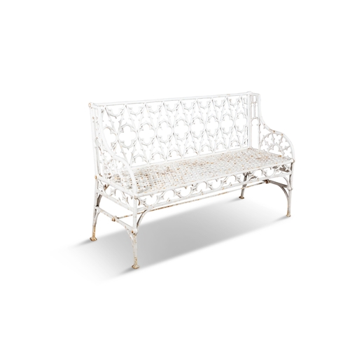 9 - A VICTORIAN WHITE PAINTED CAST IRON GARDEN BENCH  of Gothic design, the rectangular trellis back and... 