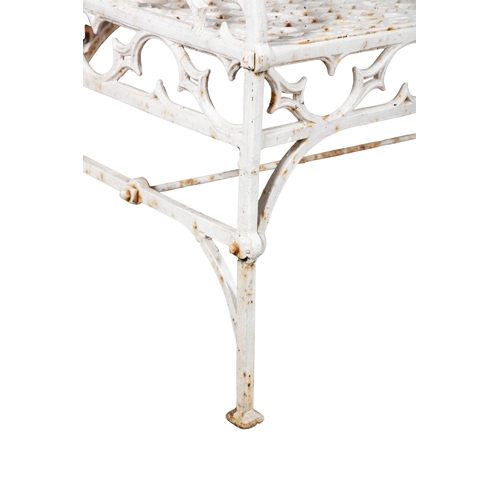 9 - A VICTORIAN WHITE PAINTED CAST IRON GARDEN BENCH  of Gothic design, the rectangular trellis back and... 