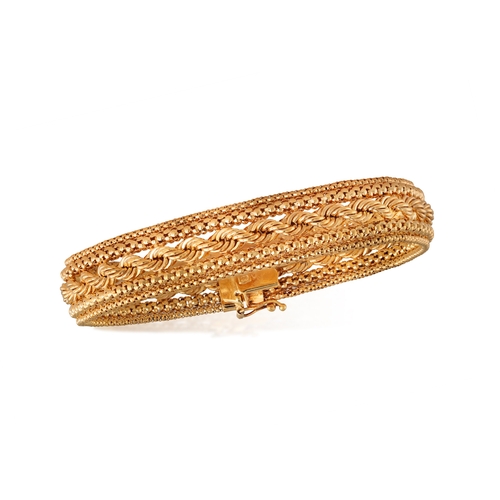 1 - UNO A ERRE: A 9K GOLD BRACELET  The bracelet composed of rope-twist and fancy-link chains, in 9K gol... 