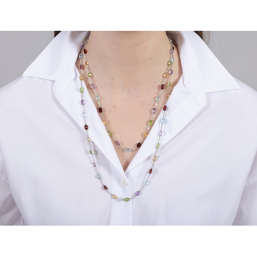 126 - A GEM-SET AND DIAMOND LONG CHAIN NECKLACE  Composed of a series of semi-precious stones, the oval-sh... 