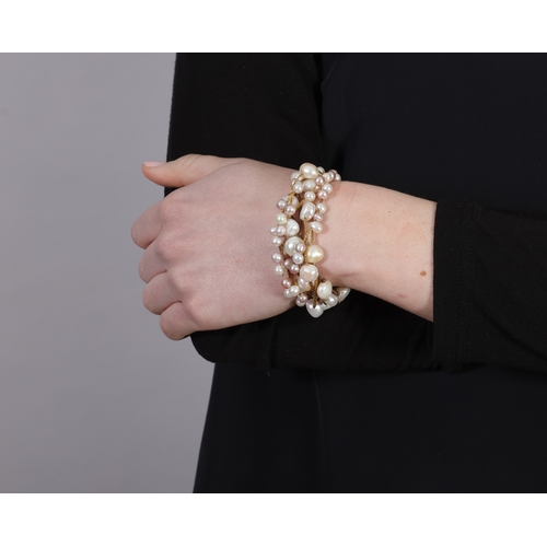 153 - PIETRO BALESTRA: A FRESHWATER CULTURED PEARL BRACELET  Composed of six woven fine-link chains and tw... 