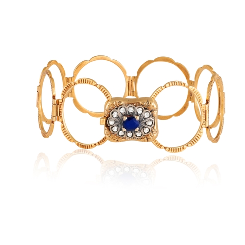 157 - A SAPPHIRE AND DIAMOND RING/BRACELET  The central motif with engraved detailing and scalloped highli... 