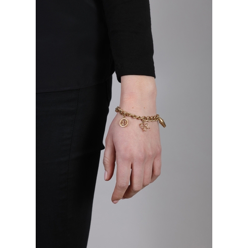 159 - A 9K GOLD CHARM BRACELET  Of curb-link chain design, suspending six various charms, including a rock... 